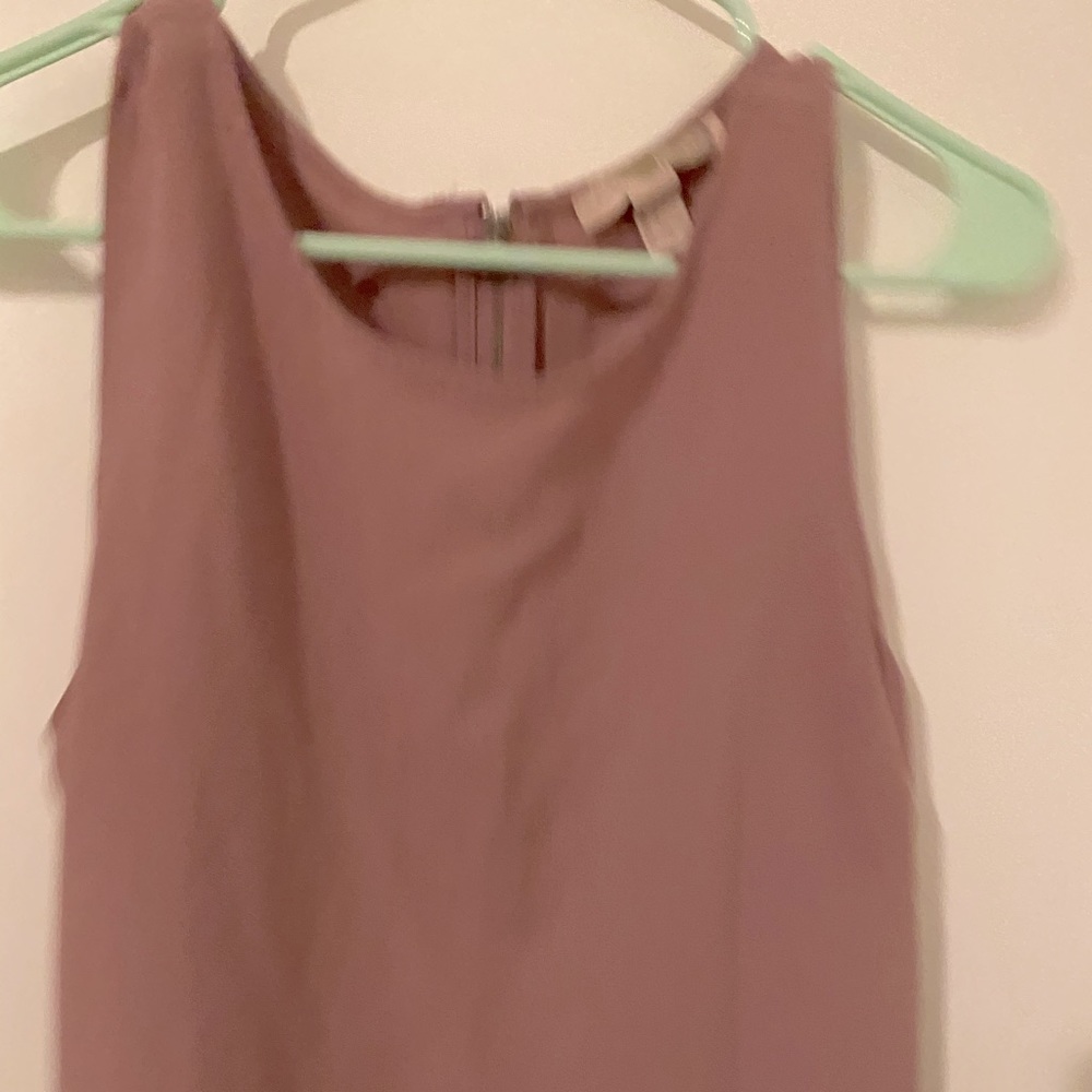 Pale pink sleeveless blouse